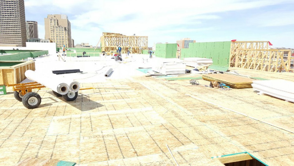 Crown crews in Oklahoma City roofing the Maywood Luxury Apartments with a Versico TPO Roof System.